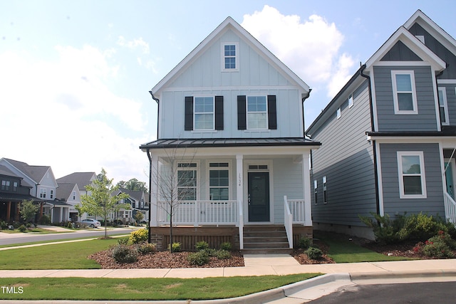1534 Millrock Trl, Wendell, NC 27591 - view of front of property featuring a porch, board and batten siding, a standing seam roof, and metal roof