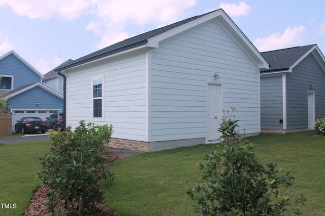 1534 Millrock Trl, Wendell, NC 27591 - view of side of property featuring a yard, an attached garage, and a shingled roof