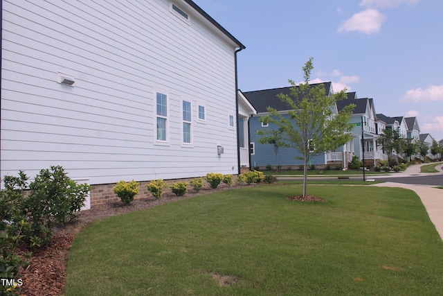 1534 Millrock Trl, Wendell, NC 27591 - view of side of home with a yard and a residential view