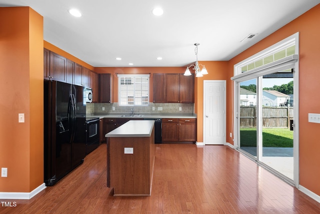 109 Citrine Ct, Durham, NC 27703 - kitchen featuring black appliances, baseboards, light countertops, tasteful backsplash, and recessed lighting