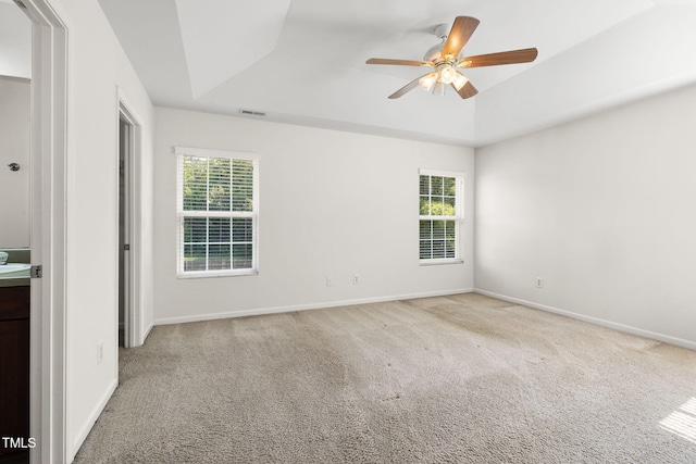 109 Citrine Ct, Durham, NC 27703 - carpeted empty room featuring a raised ceiling, ceiling fan, and baseboards
