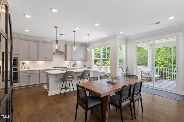 74 Permit Ct, Chapel Hill, NC 27517 - dining space with dark wood-type flooring, ornamental molding, and recessed lighting