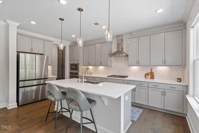 74 Permit Ct, Chapel Hill, NC 27517 - kitchen with stainless steel appliances, wall chimney exhaust hood, gray cabinets, a sink, and backsplash