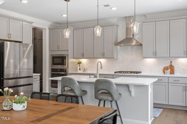 74 Permit Ct, Chapel Hill, NC 27517 - kitchen featuring stainless steel appliances, wall chimney range hood, a sink, gray cabinetry, and recessed lighting