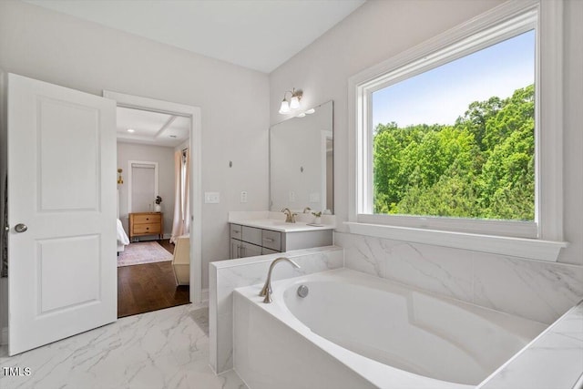 74 Permit Ct, Chapel Hill, NC 27517 - bathroom featuring a garden tub, vanity, marble finish floors, and ensuite bathroom