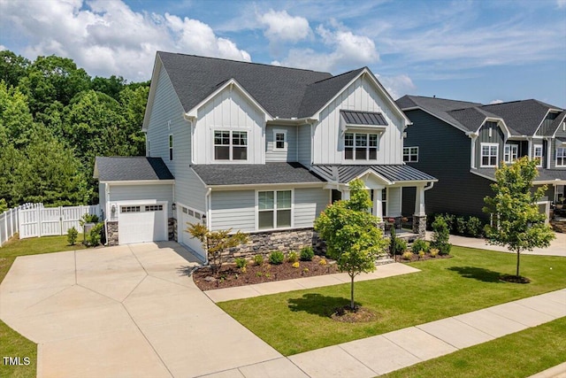74 Permit Ct, Chapel Hill, NC 27517 - view of front of property with board and batten siding, driveway, stone siding, an attached garage, and roof with shingles