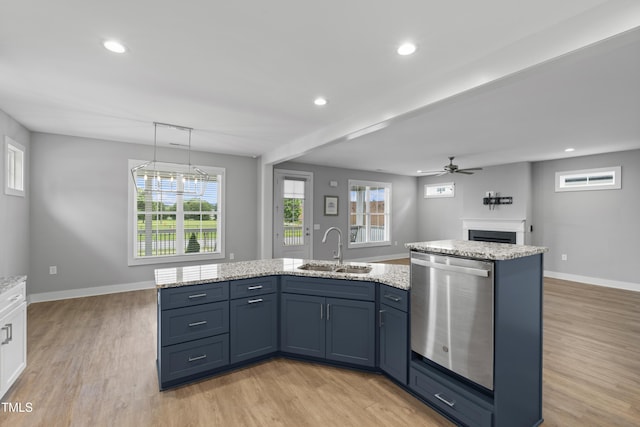 1230 S 2nd St, Smithfield, NC 27577 - kitchen with dishwasher, a sink, a fireplace, light wood finished floors, and a ceiling fan