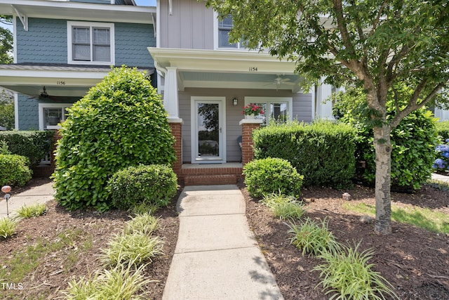 1154 Bungalow Park Dr, Apex, NC 27502 - property entrance featuring a ceiling fan, covered porch, and board and batten siding