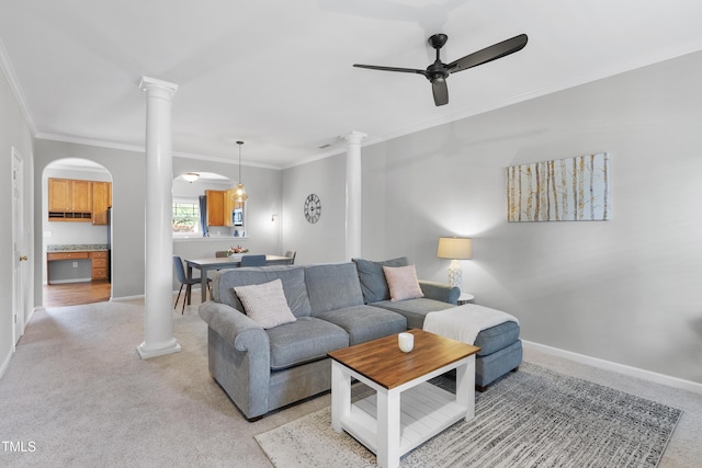 1154 Bungalow Park Dr, Apex, NC 27502 - living room featuring ornate columns, light colored carpet, a ceiling fan, and ornamental molding