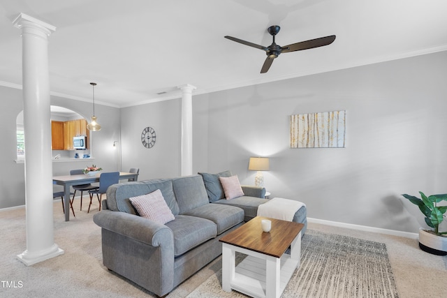 1154 Bungalow Park Dr, Apex, NC 27502 - living area with ornate columns, a ceiling fan, crown molding, and light carpet