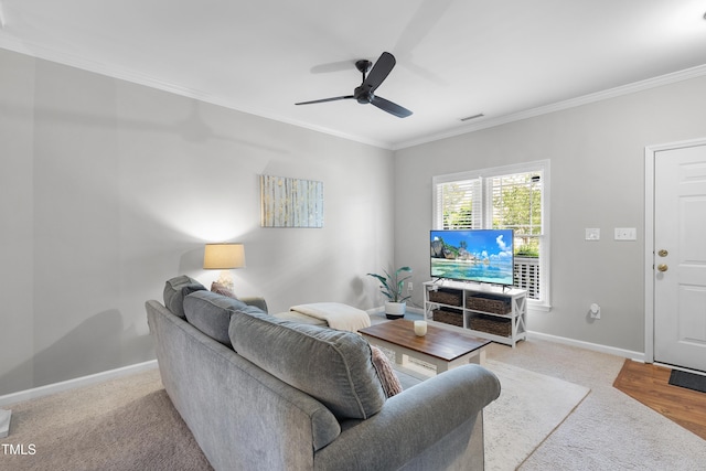 1154 Bungalow Park Dr, Apex, NC 27502 - carpeted living room featuring ornamental molding, a ceiling fan, and baseboards