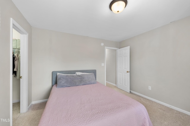 1154 Bungalow Park Dr, Apex, NC 27502 - carpeted bedroom with baseboards, a walk in closet, and a closet