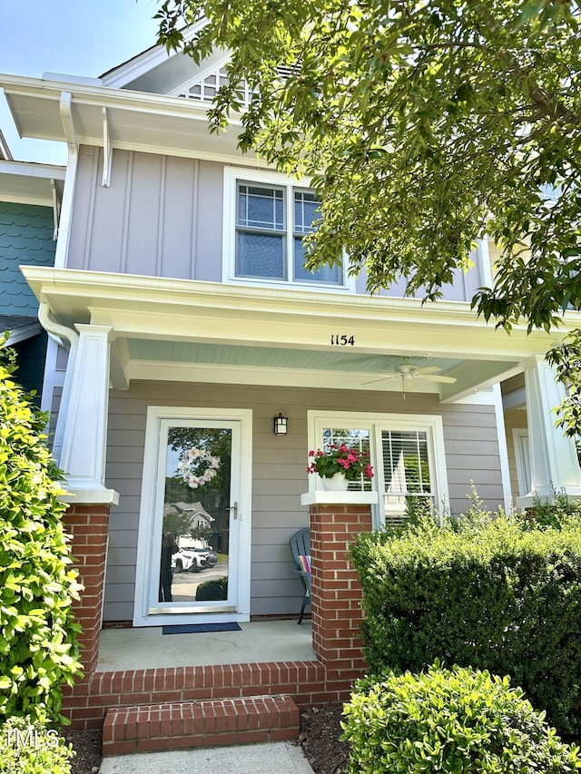 1154 Bungalow Park Dr, Apex, NC 27502 - view of exterior entry with board and batten siding and covered porch