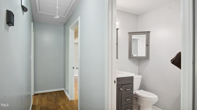 5820 Wake Forest Highway, Durham, NC 27703 - bathroom with vanity, wood finished floors, toilet, and baseboards