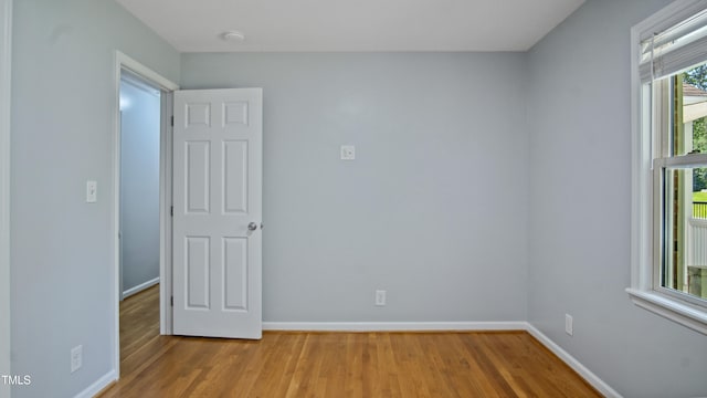 5820 Wake Forest Highway, Durham, NC 27703 - spare room featuring wood finished floors, a smoke detector, and baseboards