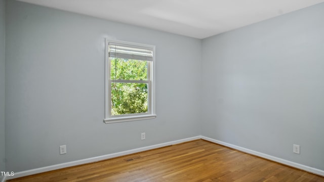 5820 Wake Forest Highway, Durham, NC 27703 - unfurnished room with baseboards and wood finished floors