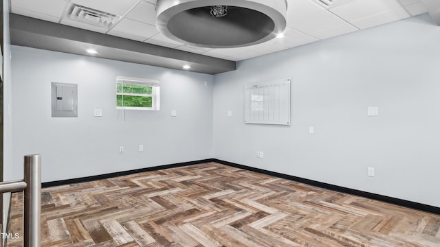 5820 Wake Forest Highway, Durham, NC 27703 - spare room with electric panel, a paneled ceiling, and baseboards