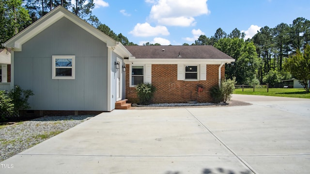 5820 Wake Forest Highway, Durham, NC 27703 - ranch-style house featuring brick siding, concrete driveway, and a shingled roof