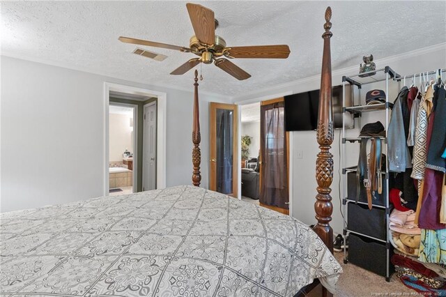 21621 Old Maxton Rd, Maxton, NC 28364 - bedroom with a textured ceiling and a ceiling fan
