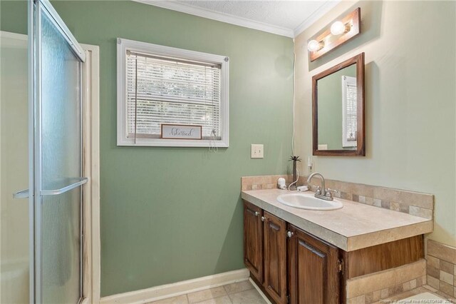 21621 Old Maxton Rd, Maxton, NC 28364 - full bathroom featuring vanity, ornamental molding, baseboards, and an enclosed shower