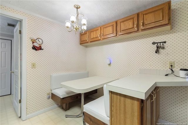 21621 Old Maxton Rd, Maxton, NC 28364 - washroom featuring crown molding, a chandelier, a textured ceiling, baseboards, and wallpapered walls