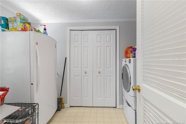 21621 Old Maxton Rd, Maxton, NC 28364 - laundry room featuring washer / dryer, a textured ceiling, ornamental molding, and light flooring