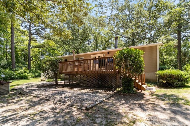 21621 Old Maxton Rd, Maxton, NC 28364 - back of house featuring a wooden deck and stairs