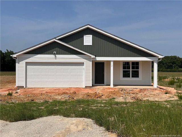 112 Dalton Dr, Lumber Bridge, NC 28357 - view of front of house with covered porch and a garage