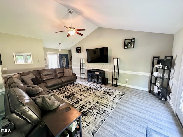 201 Joe Gibson Dr, Gibsonville, NC 27249 - living room with lofted ceiling, ceiling fan, wood finished floors, and baseboards