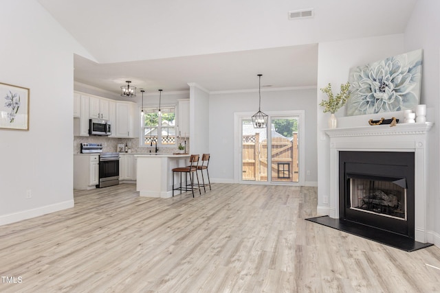 2761 Andover Glen Rd, Raleigh, NC 27604 - living room with light wood-style flooring, healthy amount of natural light, baseboards, and crown molding