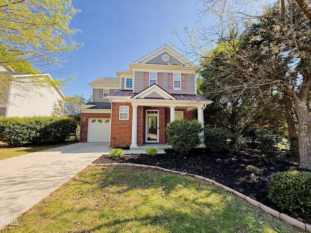 1104 Pebblestone Dr, Durham, NC 27703 - view of front of house featuring an attached garage, concrete driveway, and brick siding