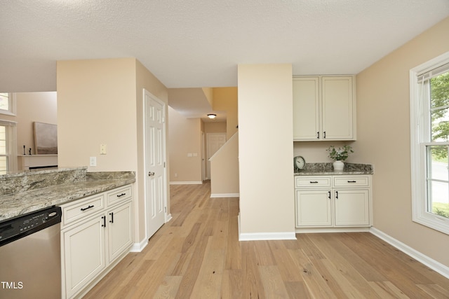 105 Old Dock Trl, Cary, NC 27519 - kitchen featuring dishwasher, light wood-type flooring, light stone countertops, and baseboards
