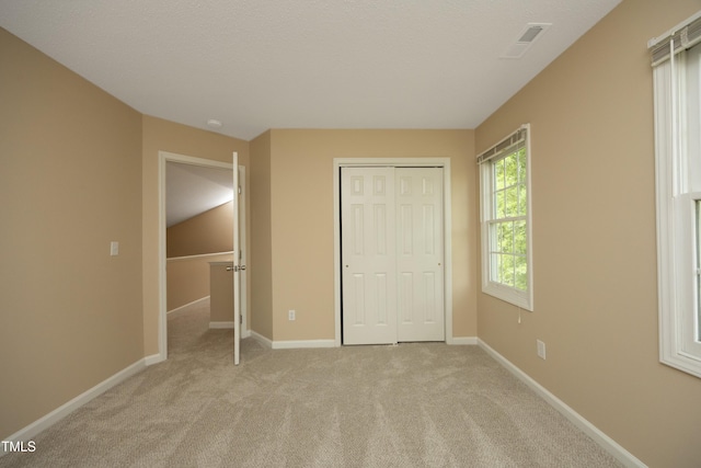 105 Old Dock Trl, Cary, NC 27519 - unfurnished bedroom with light colored carpet, baseboards, and a closet