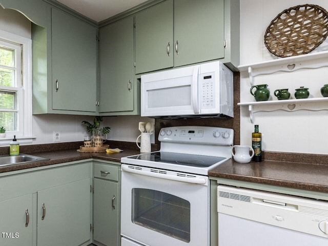 114 Brenrose Cir, Durham, NC 27705 - kitchen featuring white appliances, dark countertops, open shelves, and a sink
