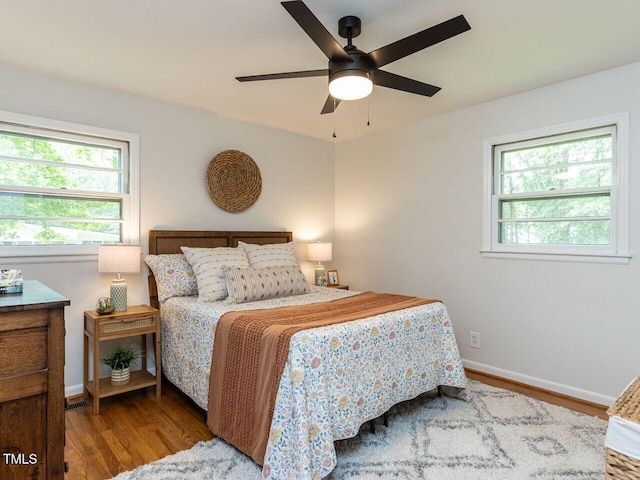 114 Brenrose Cir, Durham, NC 27705 - bedroom featuring wood finished floors, baseboards, and a ceiling fan
