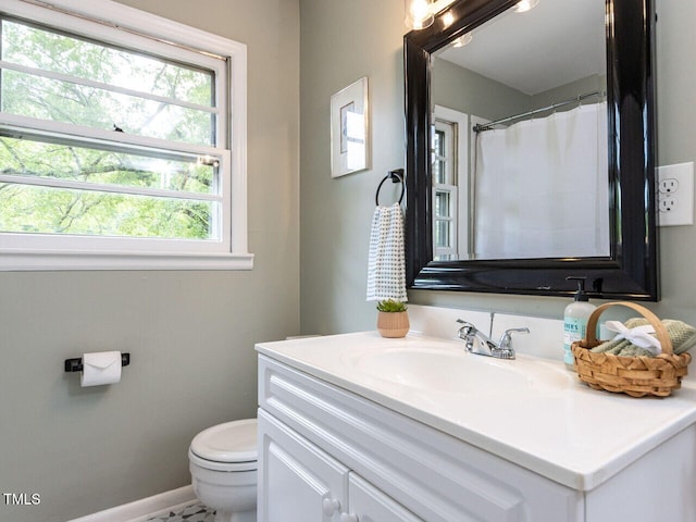 114 Brenrose Cir, Durham, NC 27705 - full bathroom featuring toilet, vanity, plenty of natural light, and baseboards