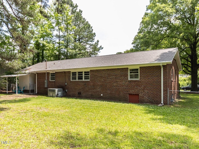 114 Brenrose Cir, Durham, NC 27705 - rear view of property featuring central AC, brick siding, roof with shingles, and crawl space