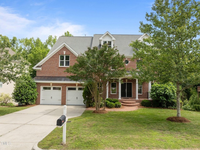 7409 Chesley Ln, Durham, NC 27713 - view of front facade with concrete driveway, an attached garage, a front lawn, and brick siding