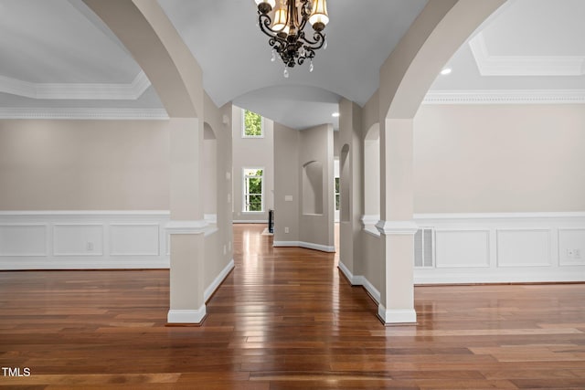 7409 Chesley Ln, Durham, NC 27713 - foyer featuring arched walkways, wood-type flooring, and a chandelier