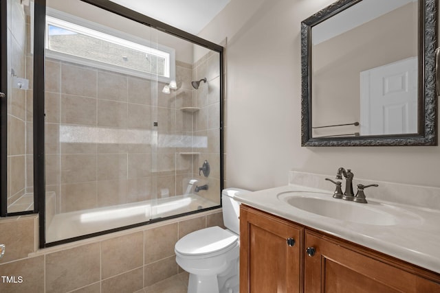 7409 Chesley Ln, Durham, NC 27713 - full bath featuring tiled shower / bath combo, toilet, and vanity