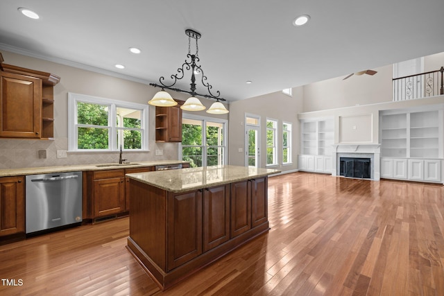 7409 Chesley Ln, Durham, NC 27713 - kitchen featuring stainless steel dishwasher, open shelves, a kitchen island, decorative light fixtures, and backsplash