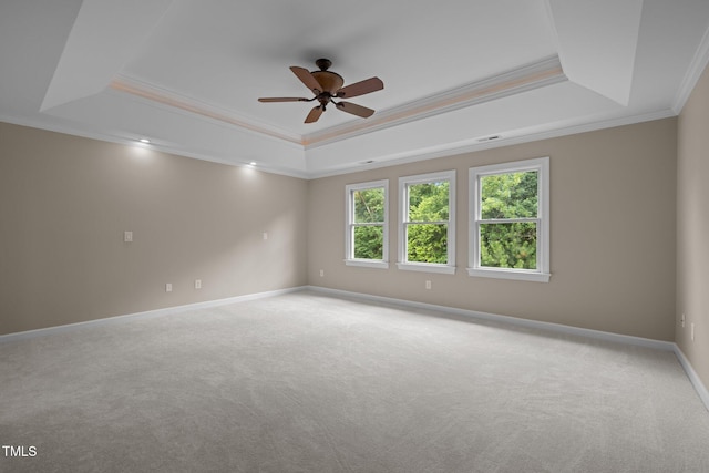 7409 Chesley Ln, Durham, NC 27713 - unfurnished room featuring a tray ceiling, ornamental molding, carpet, ceiling fan, and baseboards