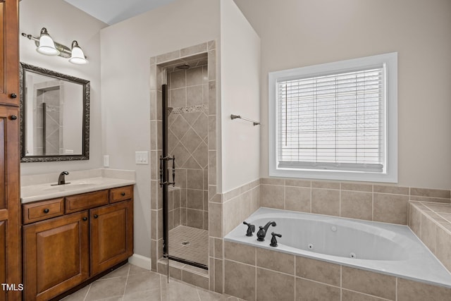 7409 Chesley Ln, Durham, NC 27713 - full bath featuring a stall shower, vanity, a tub with jets, and tile patterned flooring