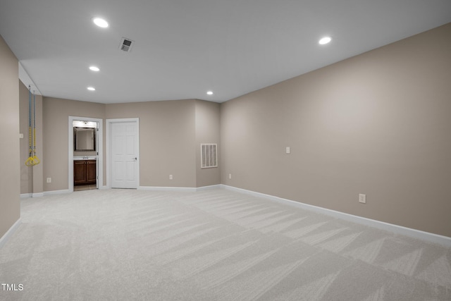 7409 Chesley Ln, Durham, NC 27713 - spare room featuring light carpet, recessed lighting, and baseboards