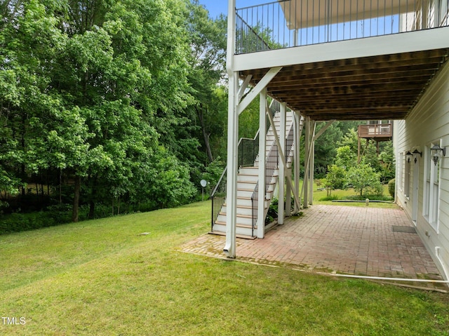 7409 Chesley Ln, Durham, NC 27713 - view of grassy yard featuring stairs and a patio area