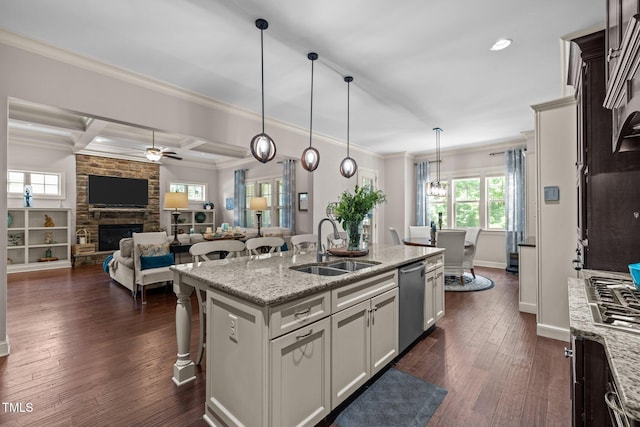 12216 Kyle Abbey Ln, Raleigh, NC 27613 - kitchen with stainless steel appliances, open floor plan, a ceiling fan, a sink, and ornamental molding