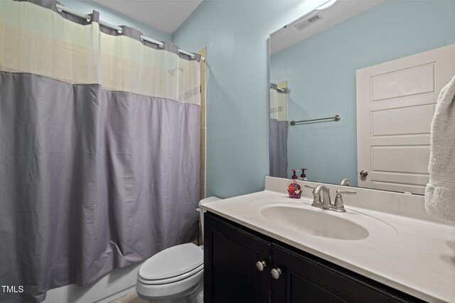 12216 Kyle Abbey Ln, Raleigh, NC 27613 - bathroom with vanity, toilet, and shower / bath combination with curtain