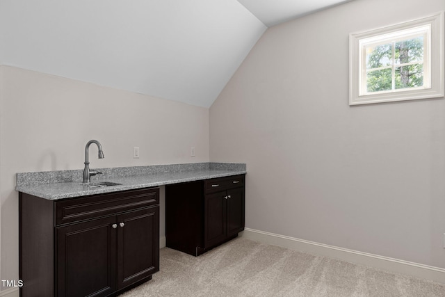 12216 Kyle Abbey Ln, Raleigh, NC 27613 - bar with a sink, vaulted ceiling, light carpet, and baseboards