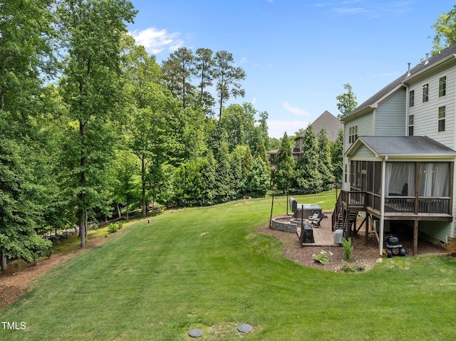 12216 Kyle Abbey Ln, Raleigh, NC 27613 - view of grassy yard featuring a sunroom and a patio area