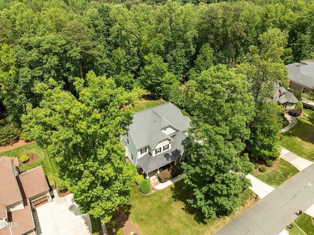 12216 Kyle Abbey Ln, Raleigh, NC 27613 - aerial perspective of suburban area with a forest